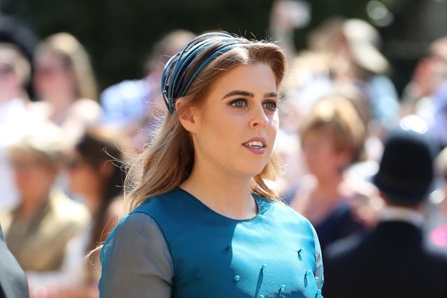 <p>Princess Beatrice arrives at St George's Chapel at Windsor Castle before the wedding of Prince Harry to Meghan Markle on May 19, 2018</p>
