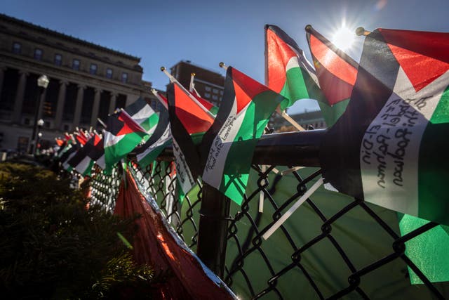 <p>A row of Palestinian flags are seen on the fence at the pro-Palestinian demonstration encampment at Columbia University in New York on Wednesday April 24, 2024</p>