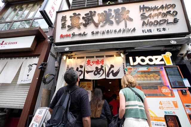 <p>Participants of Tokyo Ramen Tours enter Shinbusakiya, a ramen shop which offers ‘Hokkaido classics’ at Shibuya district</p>