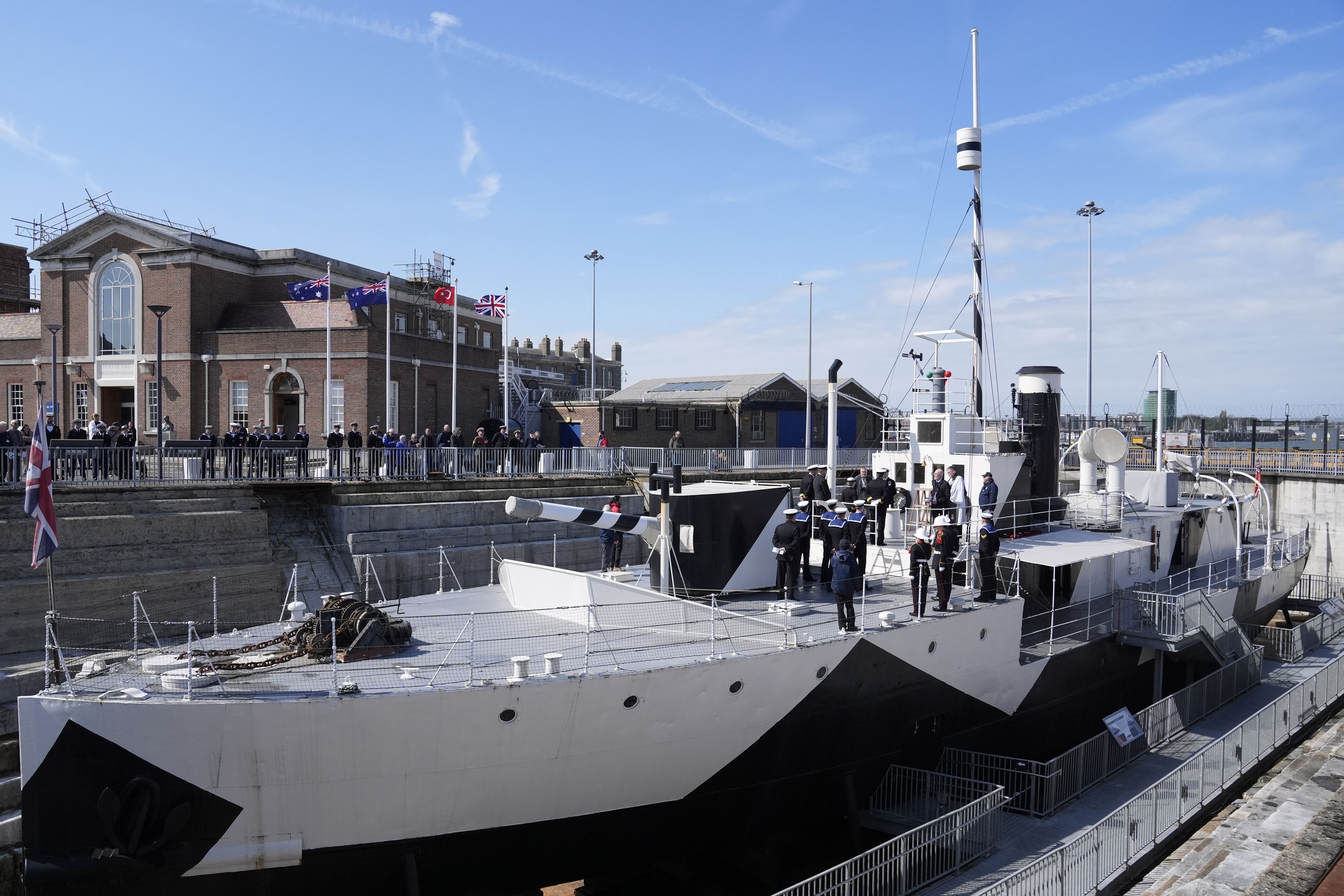 Members of the Royal Navy, Royal New Zealand Navy and Royal Australian Navy take part in an Anzac Day service of remembrance on board HMS M.33, the sole-surviving ship from the Gallipoli campaign, at the National Museum of the Royal Navy at Portsmouth Historic Dockyard (Andrew Matthews/PA)