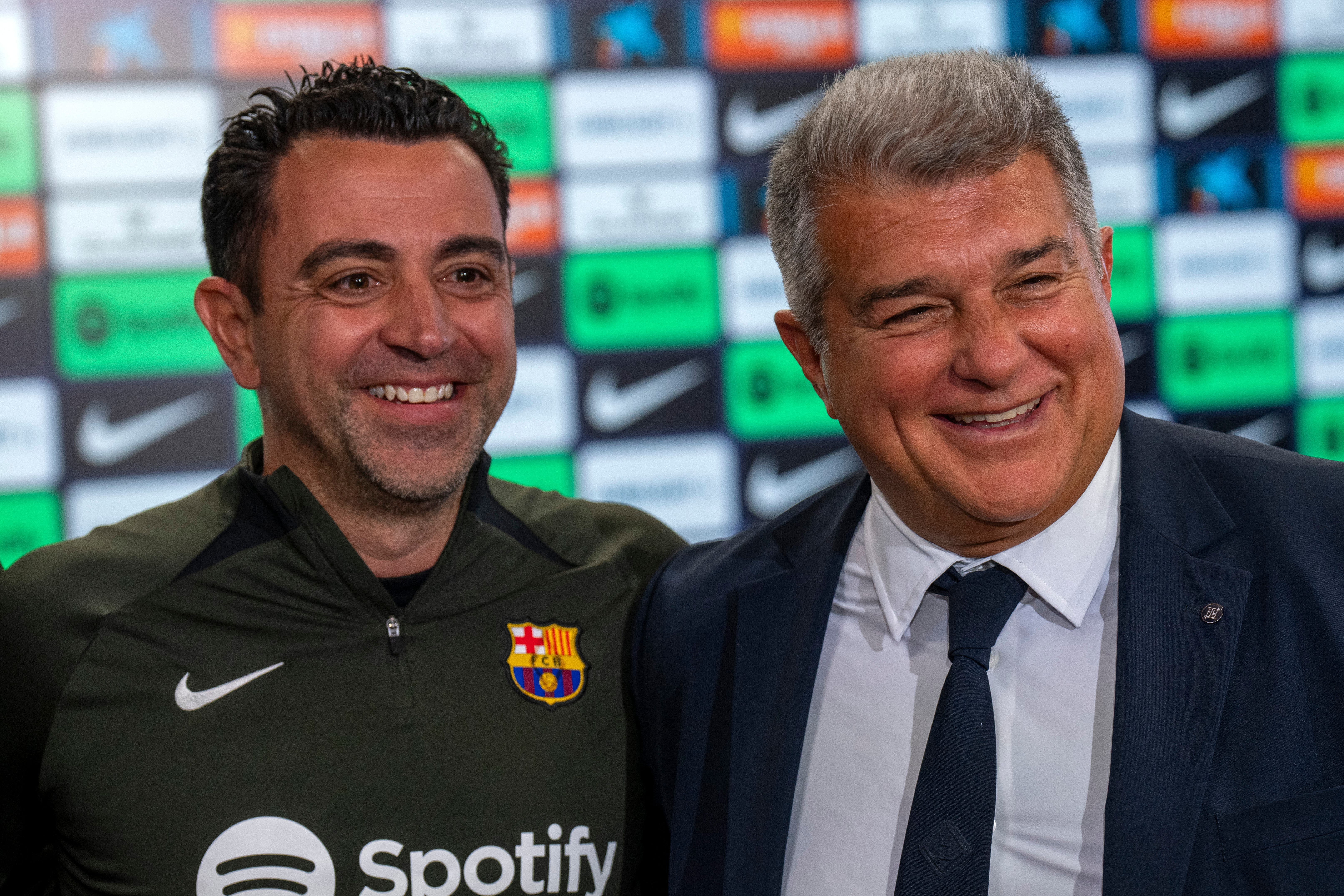 <p>Barcelona head coach Xavi and president Joan Laporta </p>