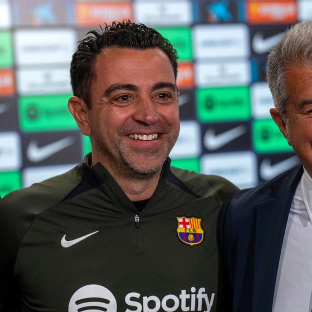<p>Barcelona head coach Xavi and president Joan Laporta </p>