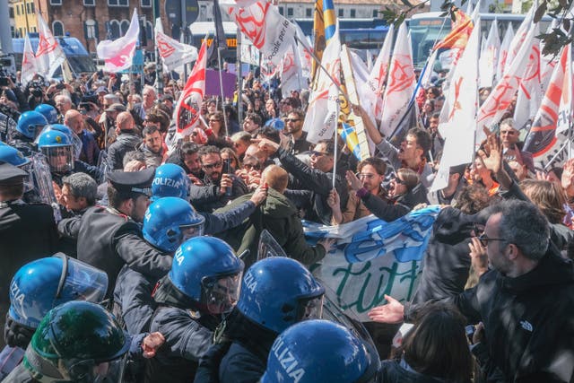 <p>Demonstrators try to break through the blockade created by police officers to enter the city at Piazzale Roma, opposing the charge for tourists to enter the city on April 25, 2024 in Venice, Italy.</p>