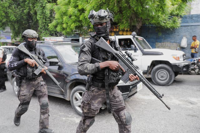 <p>Security personnel patrols near the Villa d'Accueil where Haiti's transition council will be installed, on the outskirts of Port-au-Prince</p>