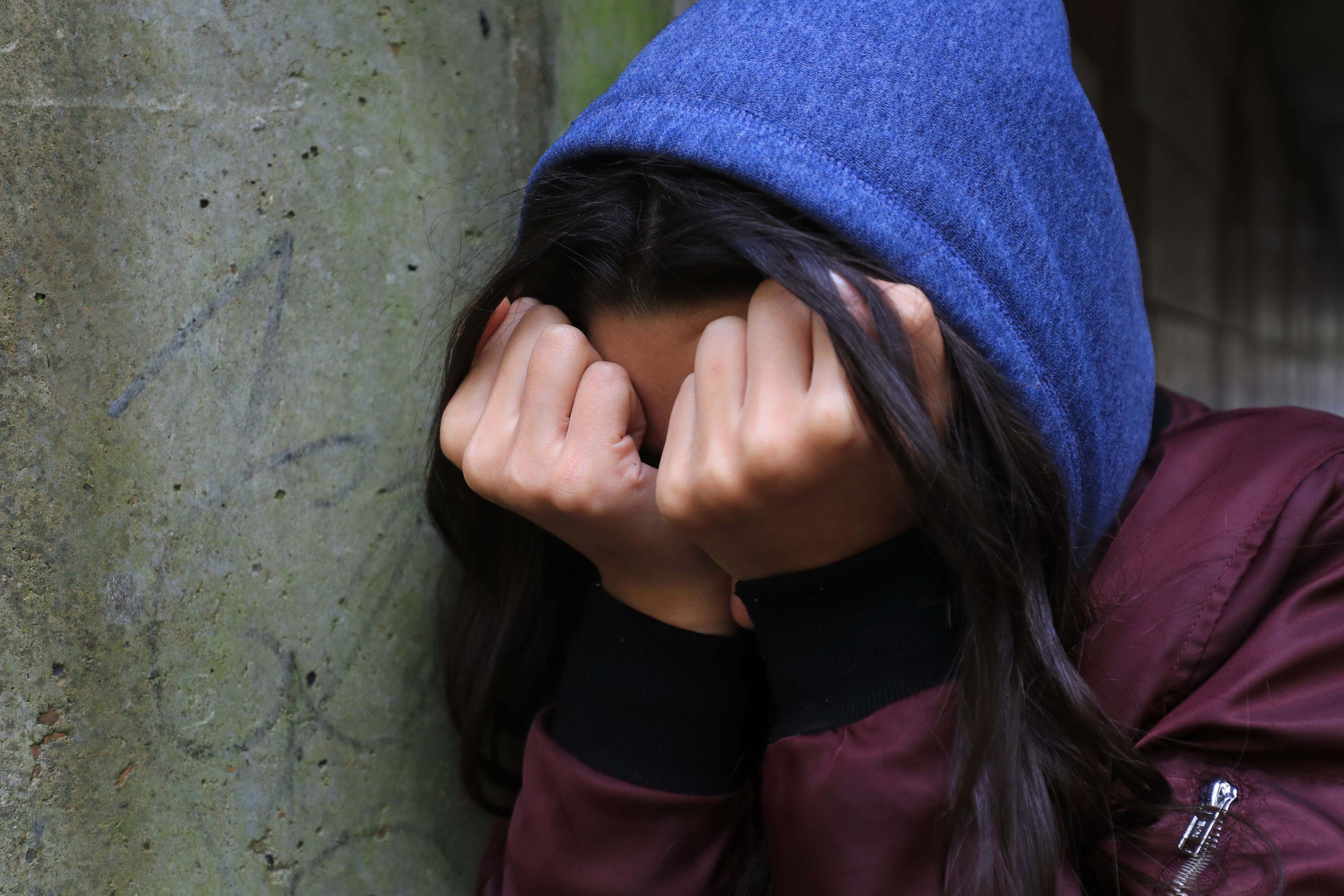 PICTURE POSED BY A MODEL A teenage girl with her head in her hands (PA)