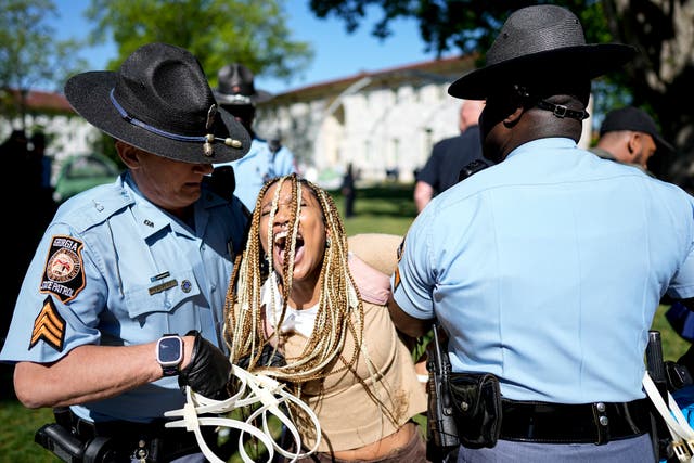 <p>Georgia State Patrol officers detain a demonstrator on the campus of Emory University during a Gaza solidarity protest on Thursday, April 25, 2024, in Atlanta.</p>