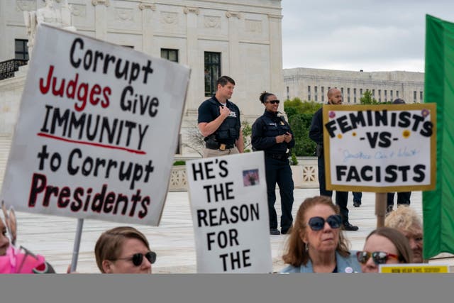 <p>Activists rally as Supreme Court's justices prepare to hear arguments on whether former President Donald Trump is immune from prosecution in Special Counsel Jack Smith's election interference case, at the Supreme Court in Washington, DC, USA, 25 April 2024. </p>