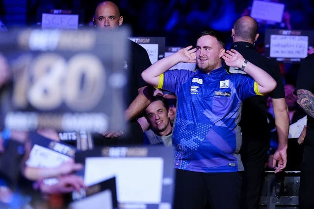 Luke Littler overcame a hostile reception in Liverpool to win his opening match in the Premier League in Liverpool (Peter Byrne/PA)