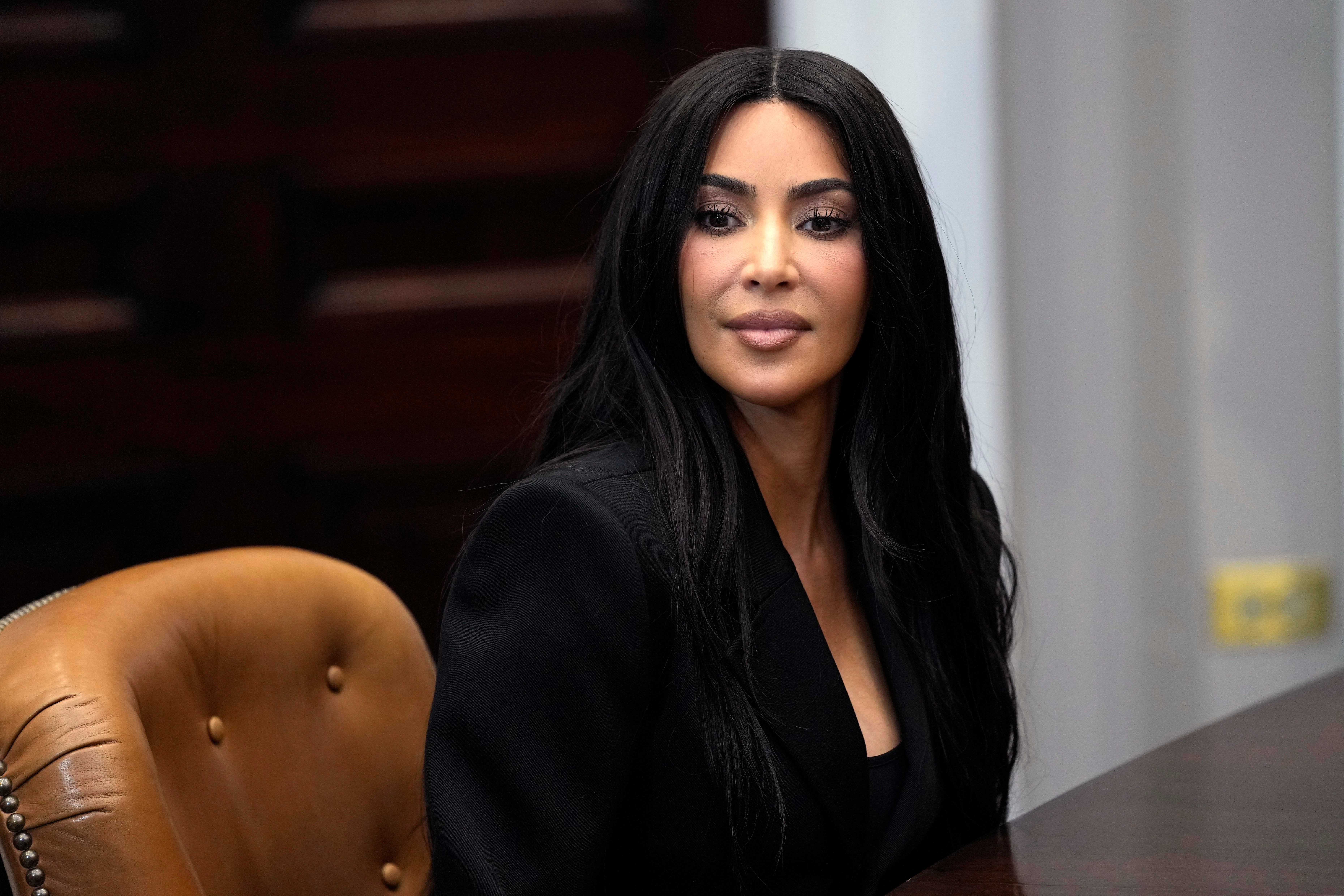 Kim Kardashian listens during a discussion in the Roosevelt Room of the White House in Washington, Thursday, April 25, 2024