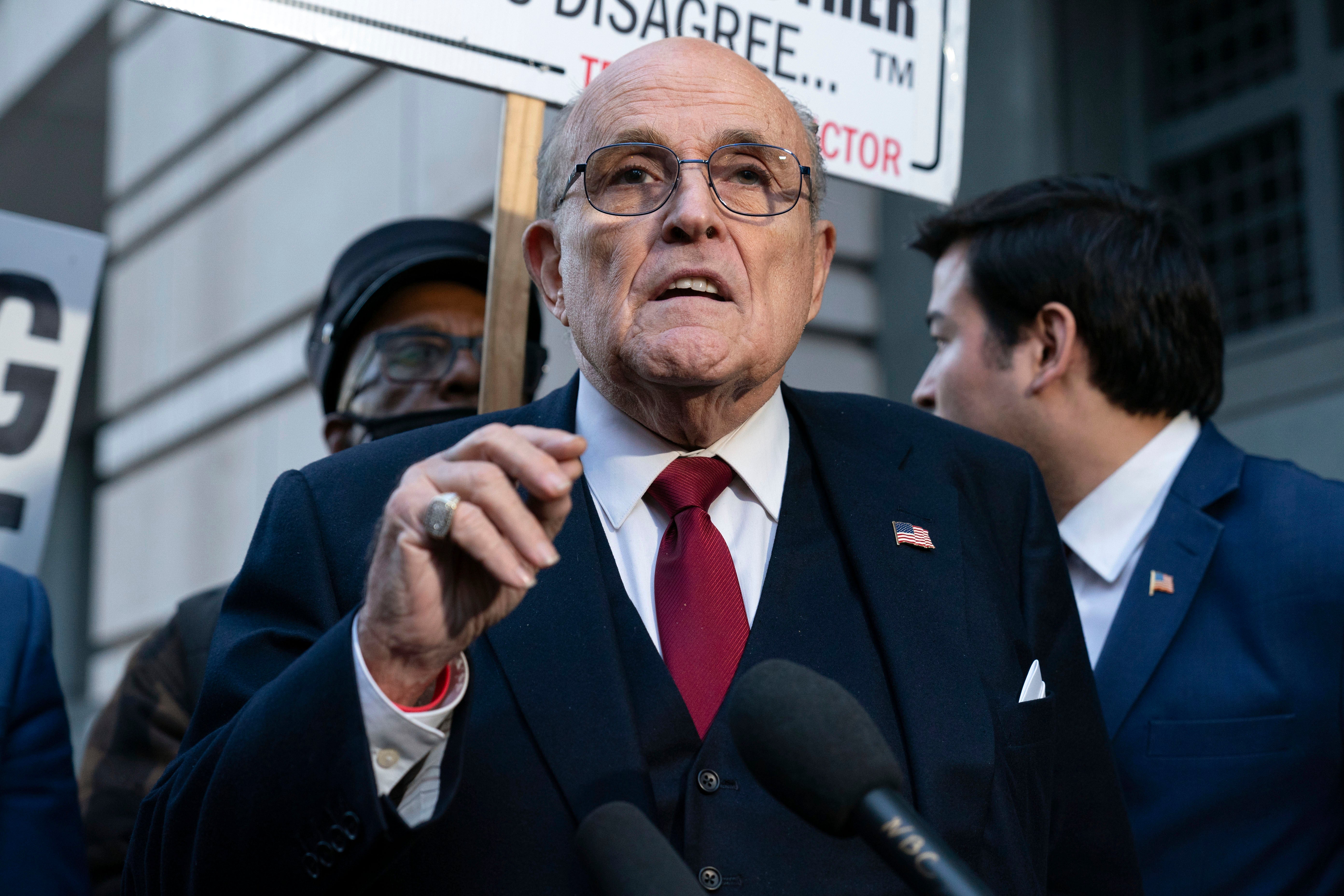 Former Mayor of New York Rudy Giuliani speaks during a news conference outside the federal courthouse in Washington, December15, 2023.
