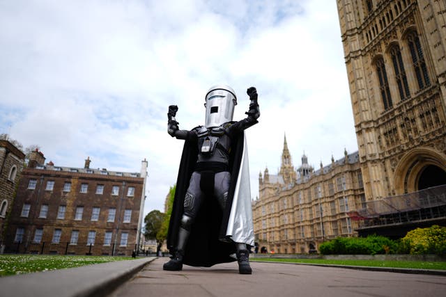 <p>Mayor of London election candidate Count Binface poses outside Parliament in London. (Aaron Chown/PA)</p>