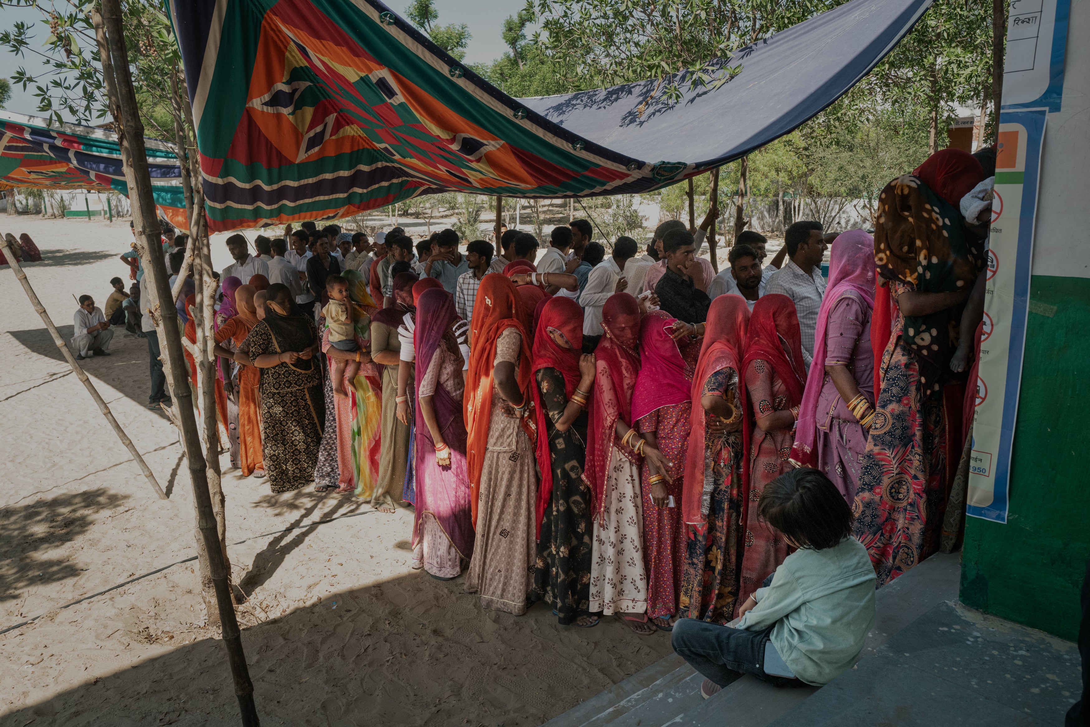 People line up to vote in the second phase of India’s national election in Rajasthan on Friday