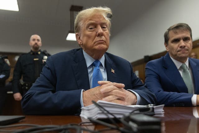 <p>Former president Donald Trump, sitting with attorney Todd Blanche at his first criminal trial on 26 April 2024</p>