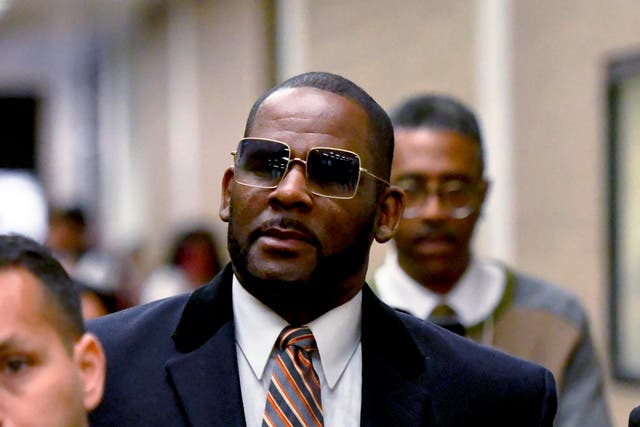 <p>R Kelly leaving the Daley Center after a hearing in his child support case in Chicago in May 2019 </p>