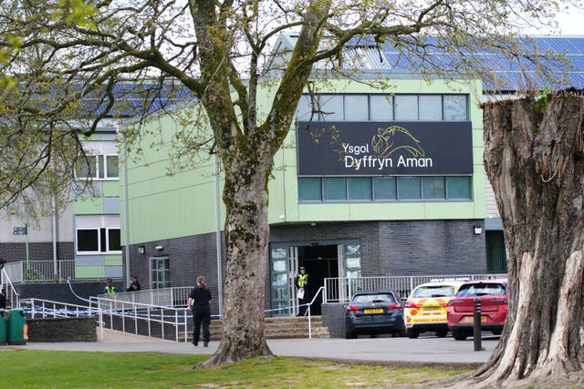 Police at Amman Valley school, in Ammanford, Carmarthenshire (PA)