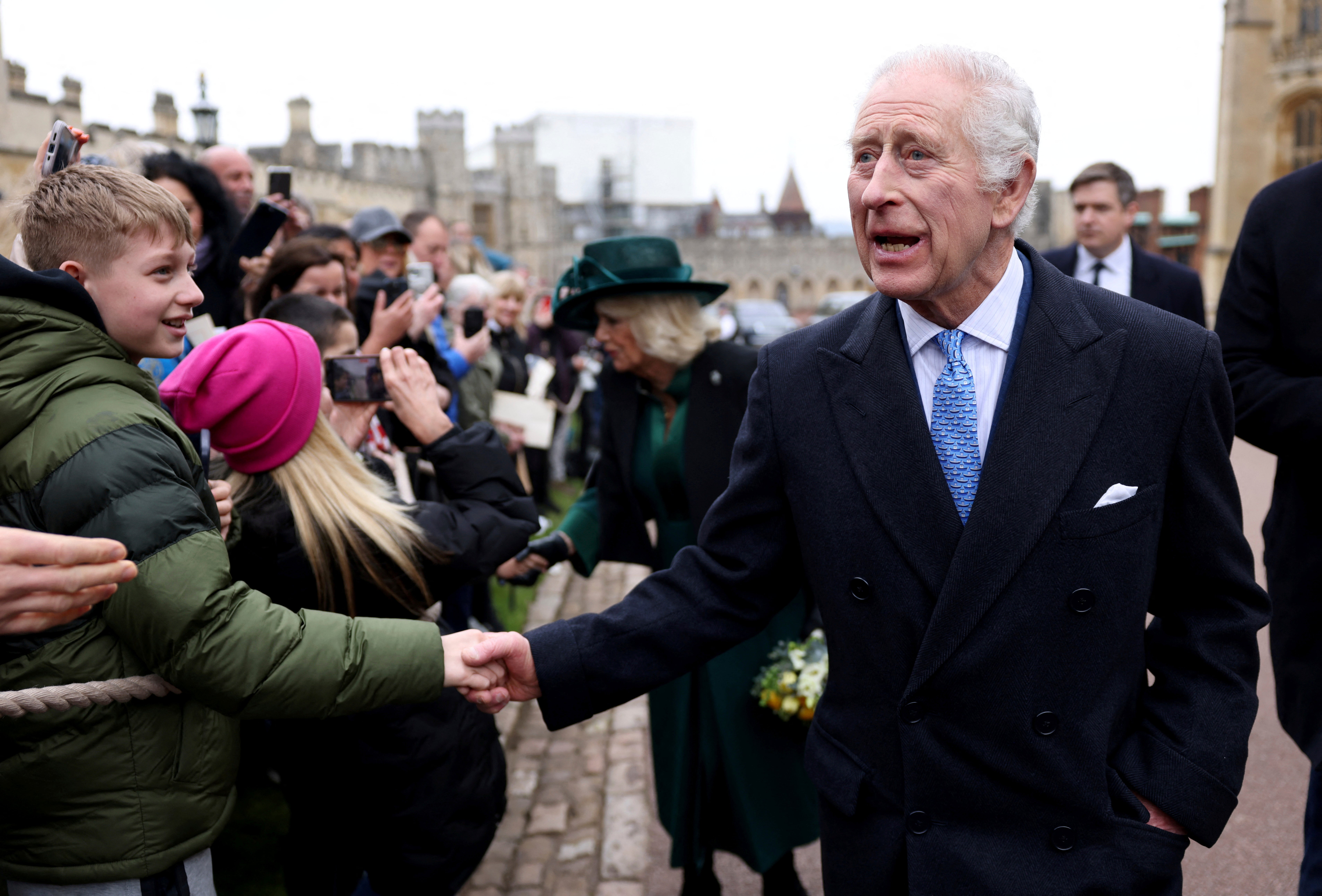 King Charles III and Queen Camilla greet people after attending the Easter Matins Service at St. George’s Chapel, Windsor Castle