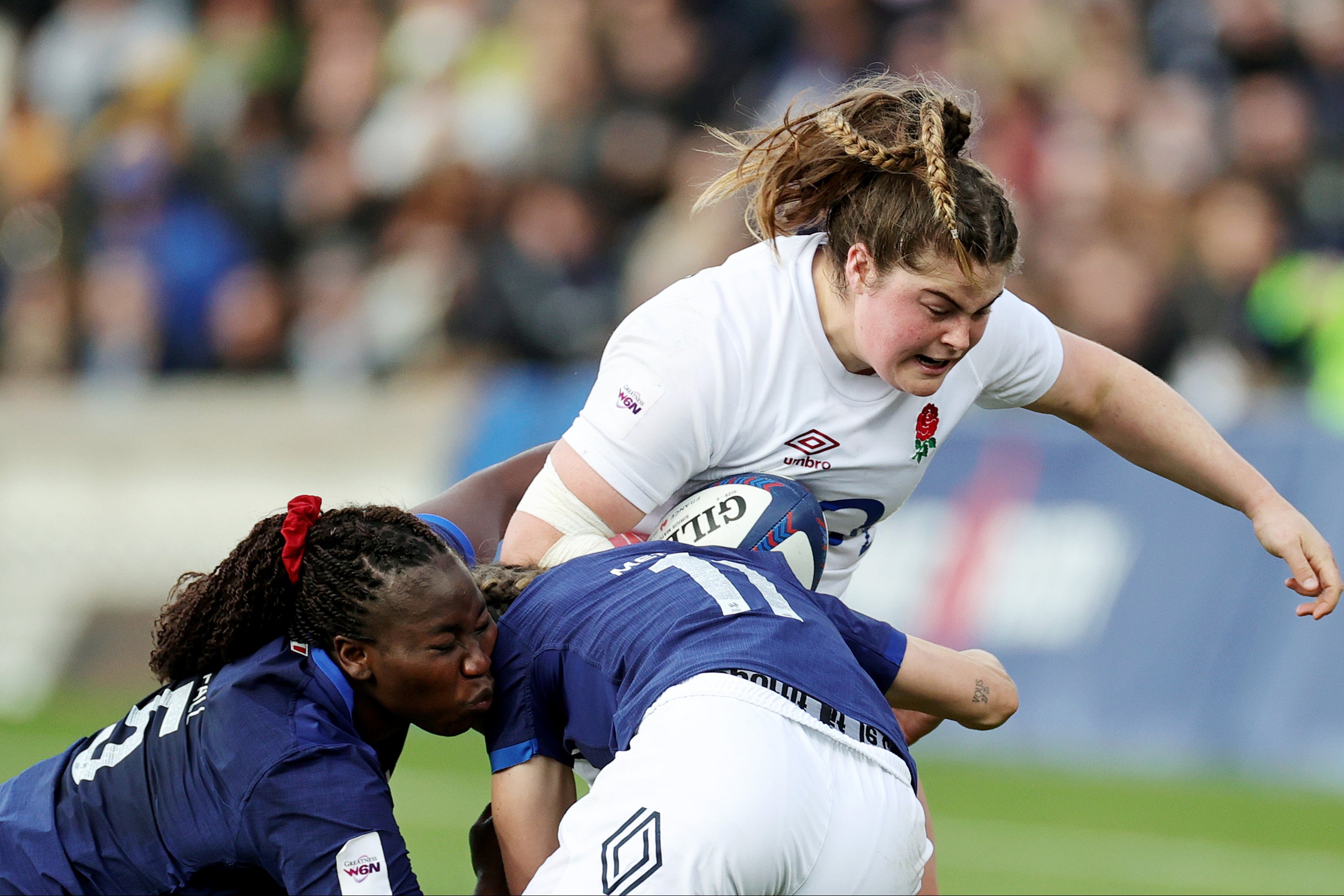 Maud Muir drives forward for the Red Roses