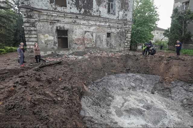 <p>A crater at the site of hospital buildings damaged by a Russian missile strike in Karkhiv</p>