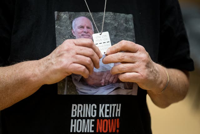 <p>Former Hamas hostage Aviva Siegel poses with a t-shirt showing a picture of her husband Keith Siegel during her visit to the 55th session of the UN Human Rights Council in Geneva</p>