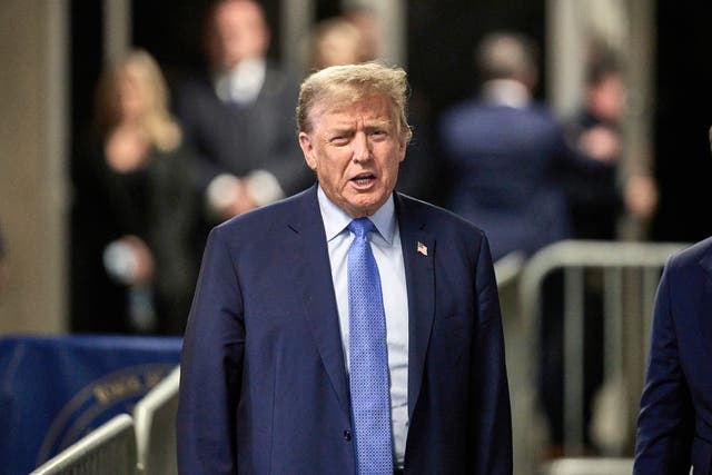 <p>Former president Donald Trump speaks with the media at the end of the day’s proceedings at his trial at Manhattan Criminal Court on Friday 26 April 2024</p>