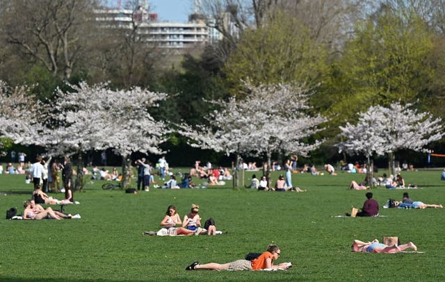 <p>Londoners enjoy the sunshine in Battersea Park as the weather is set to get warmer </p>