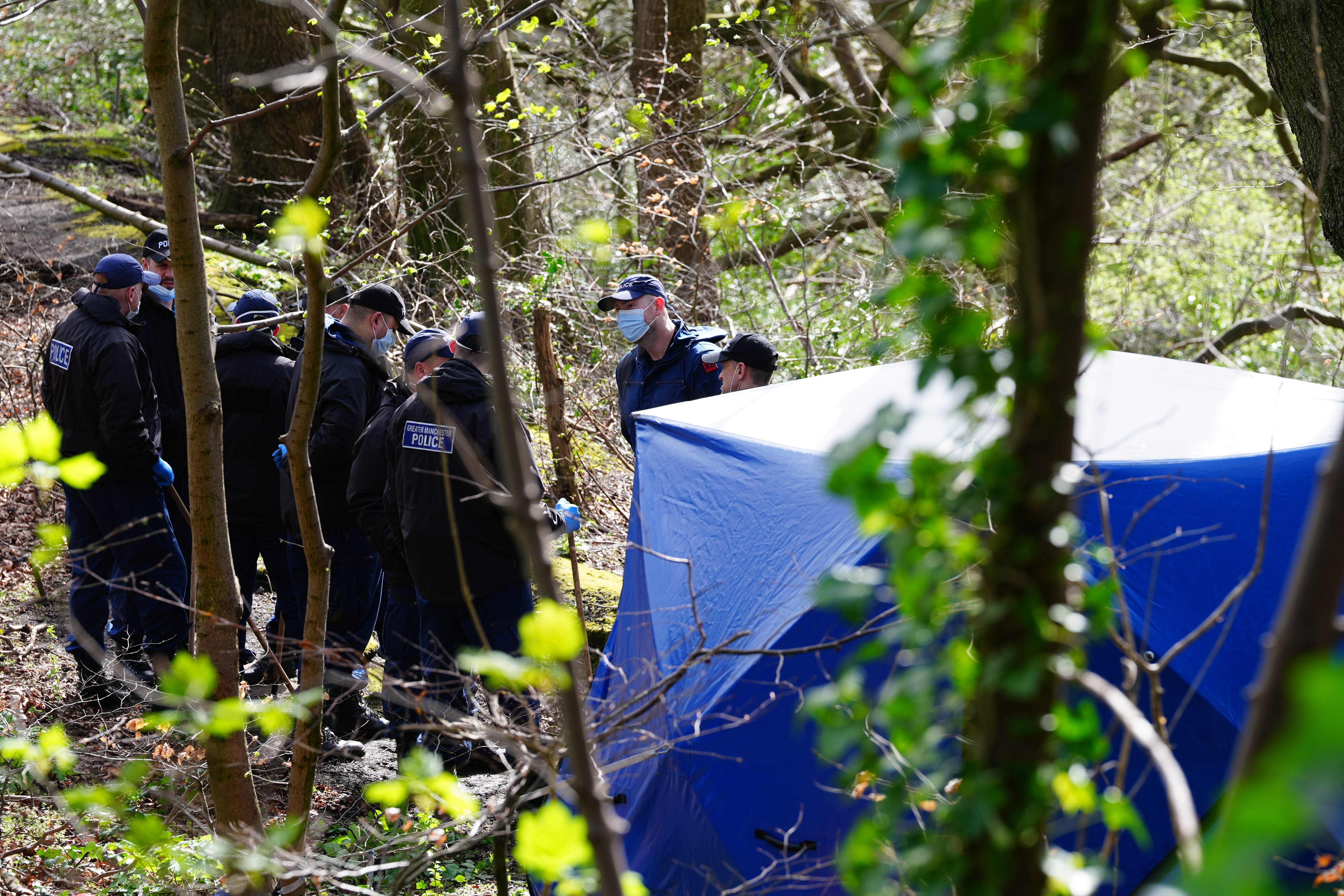 Police officers by a forensic tent at Kersal Dale (Peter Byrne/PA)