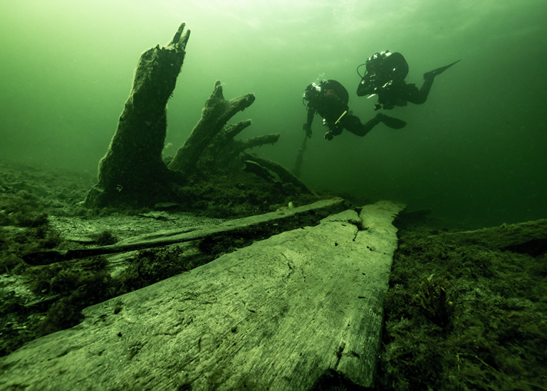 Researchers inspect and document timbers belonging to the ship’s superstructure