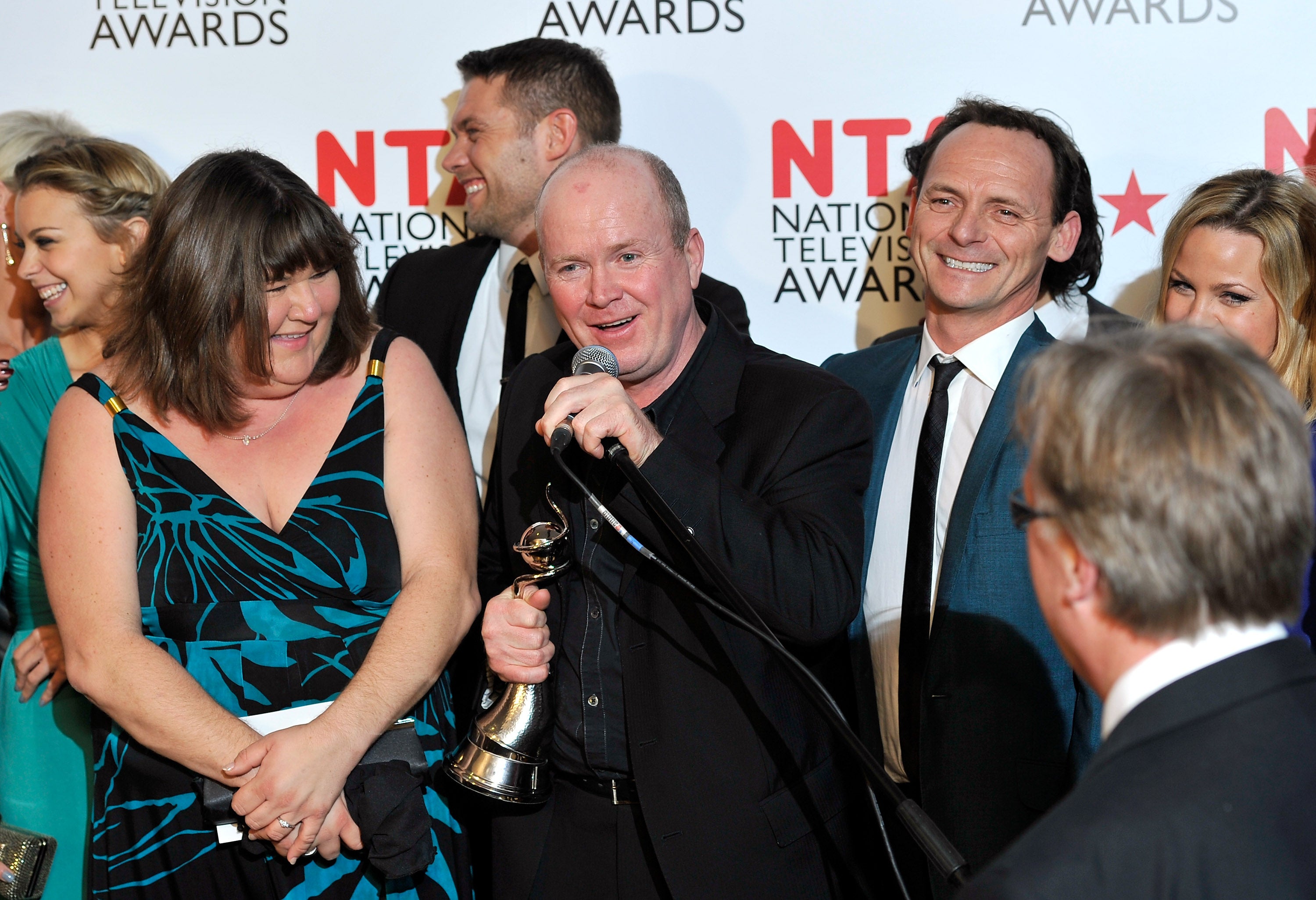 Actor Steve McFadden (C) and the cast of Eastenders with their Most Popular Serial Drama award during the National Television Awards at the O2 Arena on January 26, 2011 in London, England