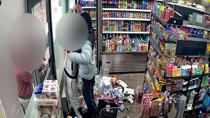 <p>Watch: Machete-wielding robbers trapped inside shop by heroic shopkeeper and customers.</p>