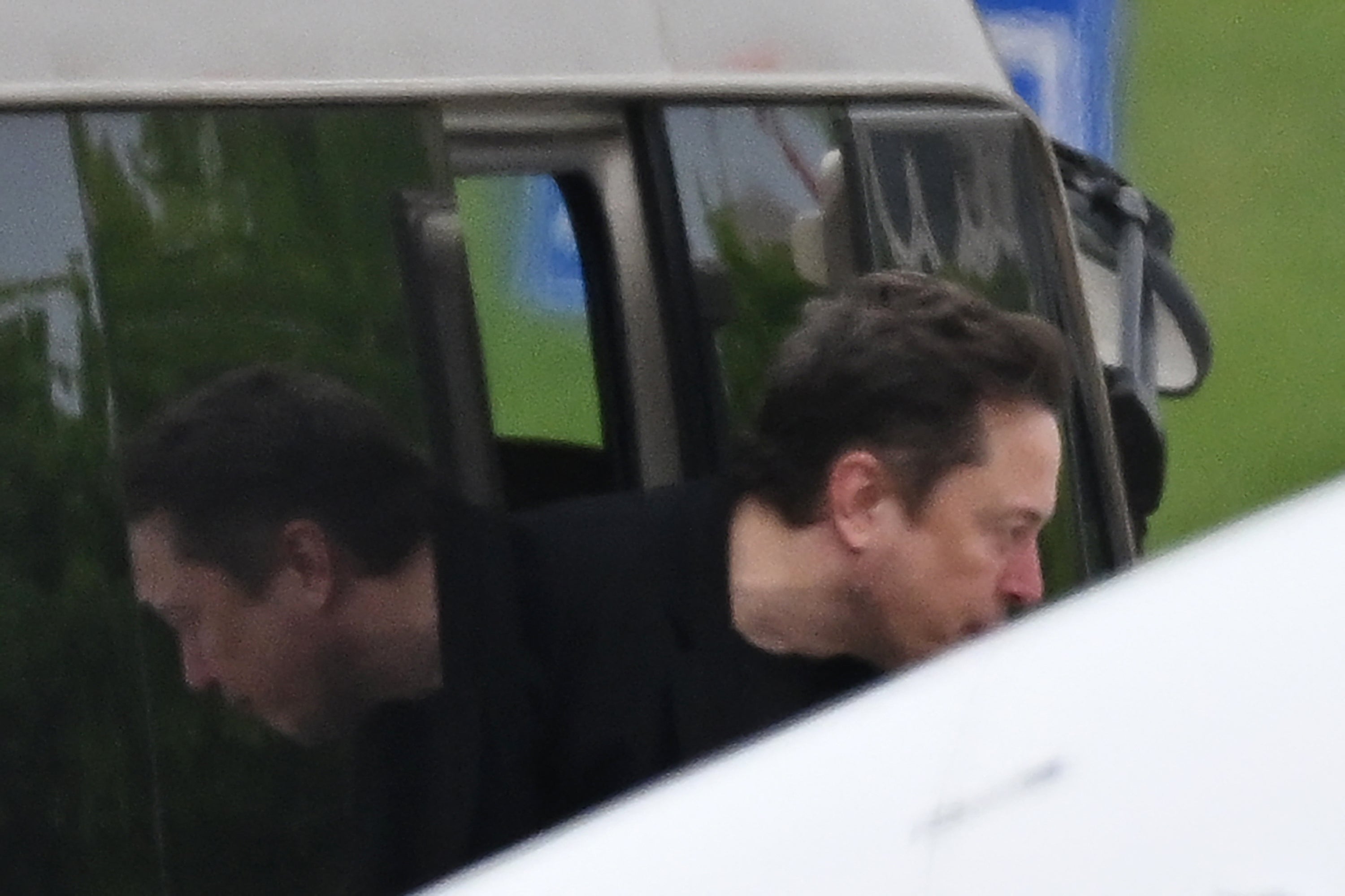 <p>Tesla CEO Elon Musk gets off a minibus before boarding his private plane at Beijing airport on April 29, 2024</p>