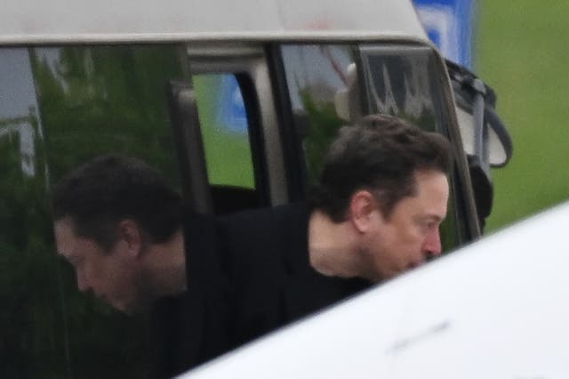 <p>Tesla CEO Elon Musk gets off a minibus before boarding his private plane at Beijing airport on April 29, 2024</p>