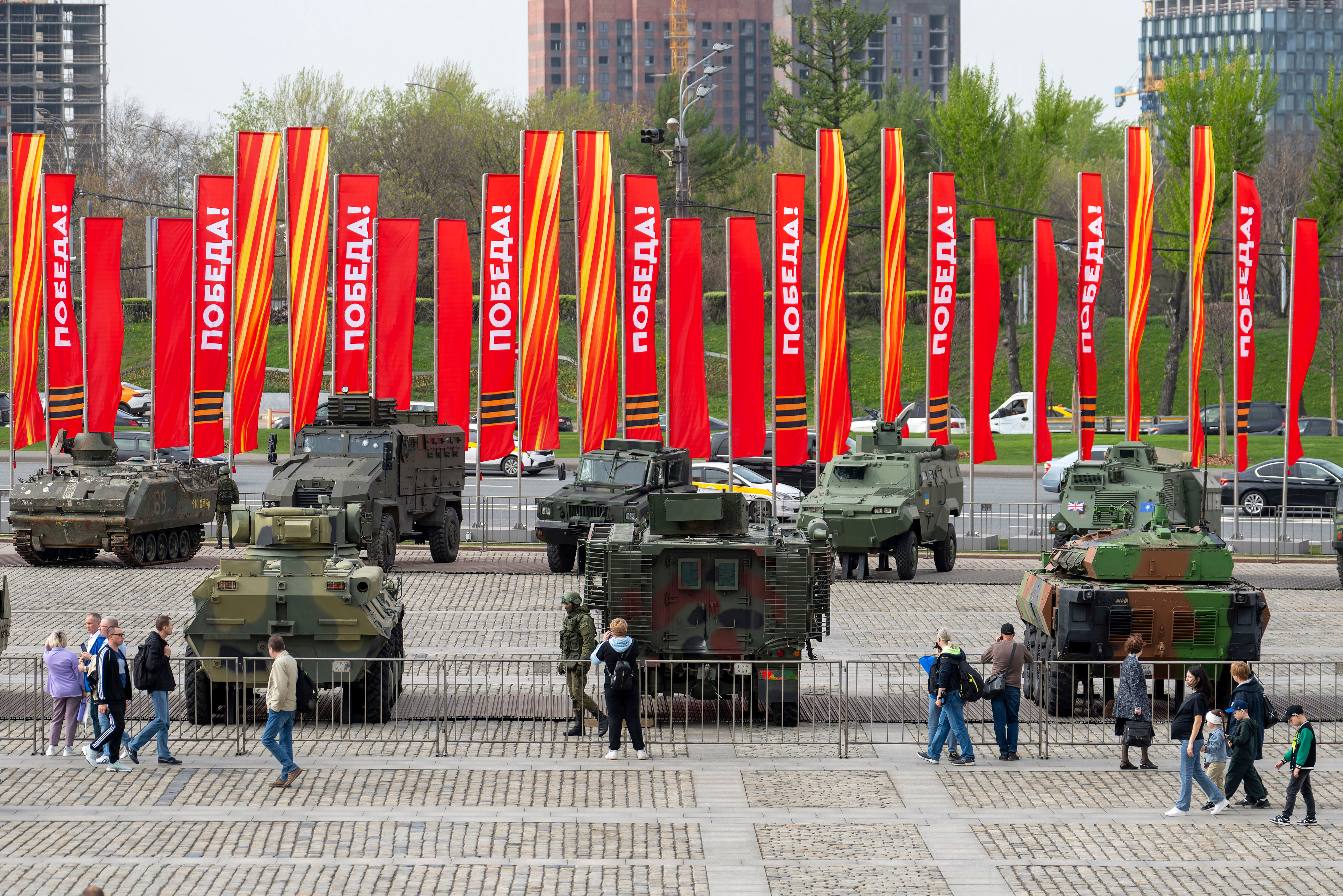 <p>People visit an exhibition of tanks, APCs and guns of Ukrainian armed forces captured during the fighting displayed near the World War II museum on Poklonnaya Hill in Moscow, Russia</p>