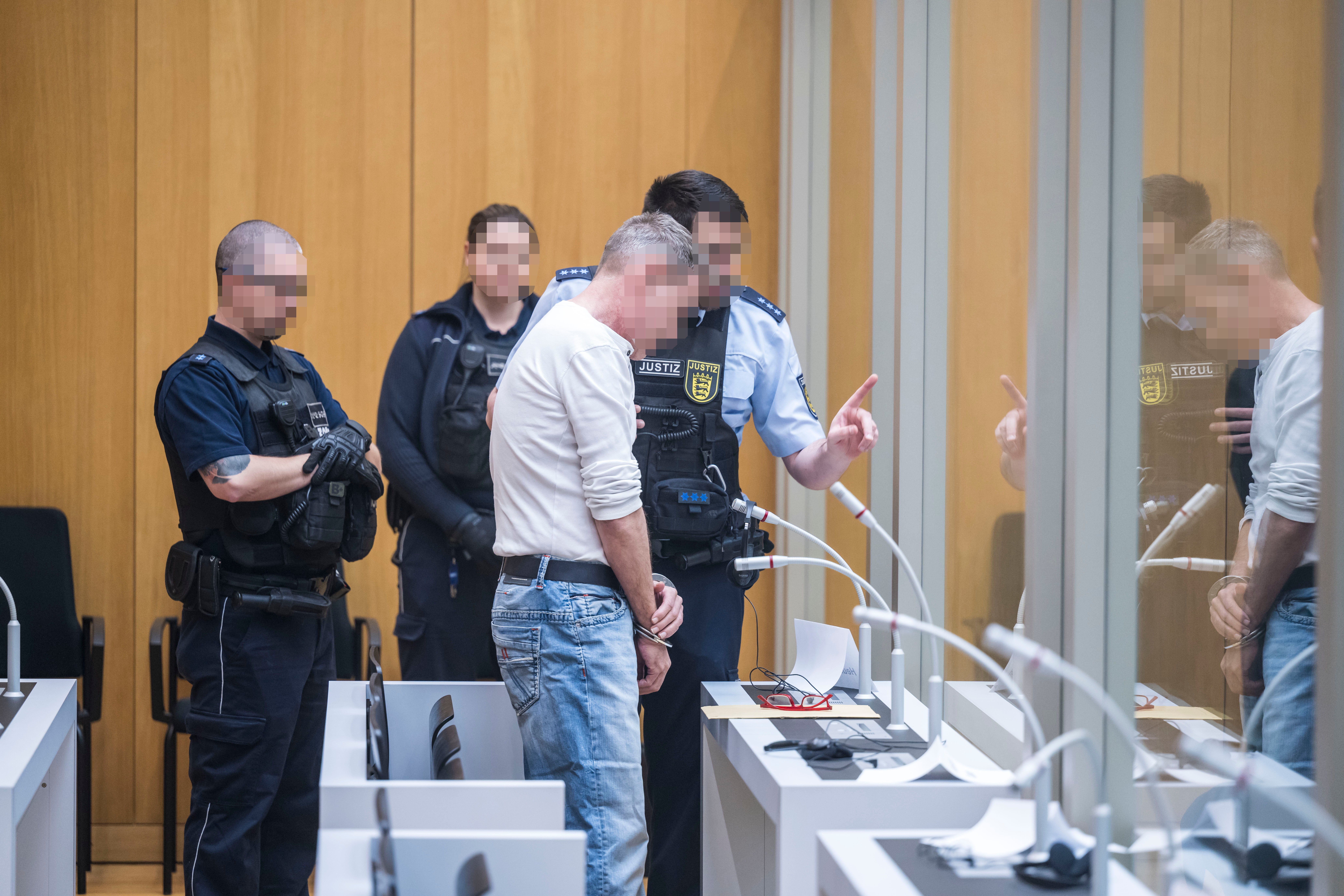 A defendant arrives on the first day of the ‘Reichsbuerger’ trial in Stuttgart, Germany, 29 April 2024