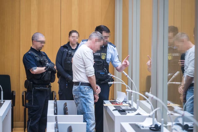 <p>A defendant arrives on the first day of the ‘Reichsbuerger’ trial in Stuttgart, Germany, 29 April 2024</p>