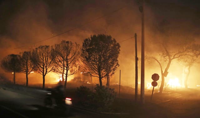 <p>Buildings burn in the town of Mati, east of Athens, Greece</p>