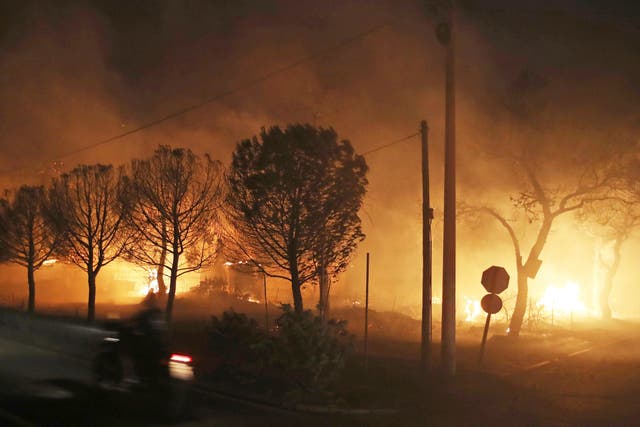 <p>Buildings burn in the town of Mati, east of Athens, Greece</p>