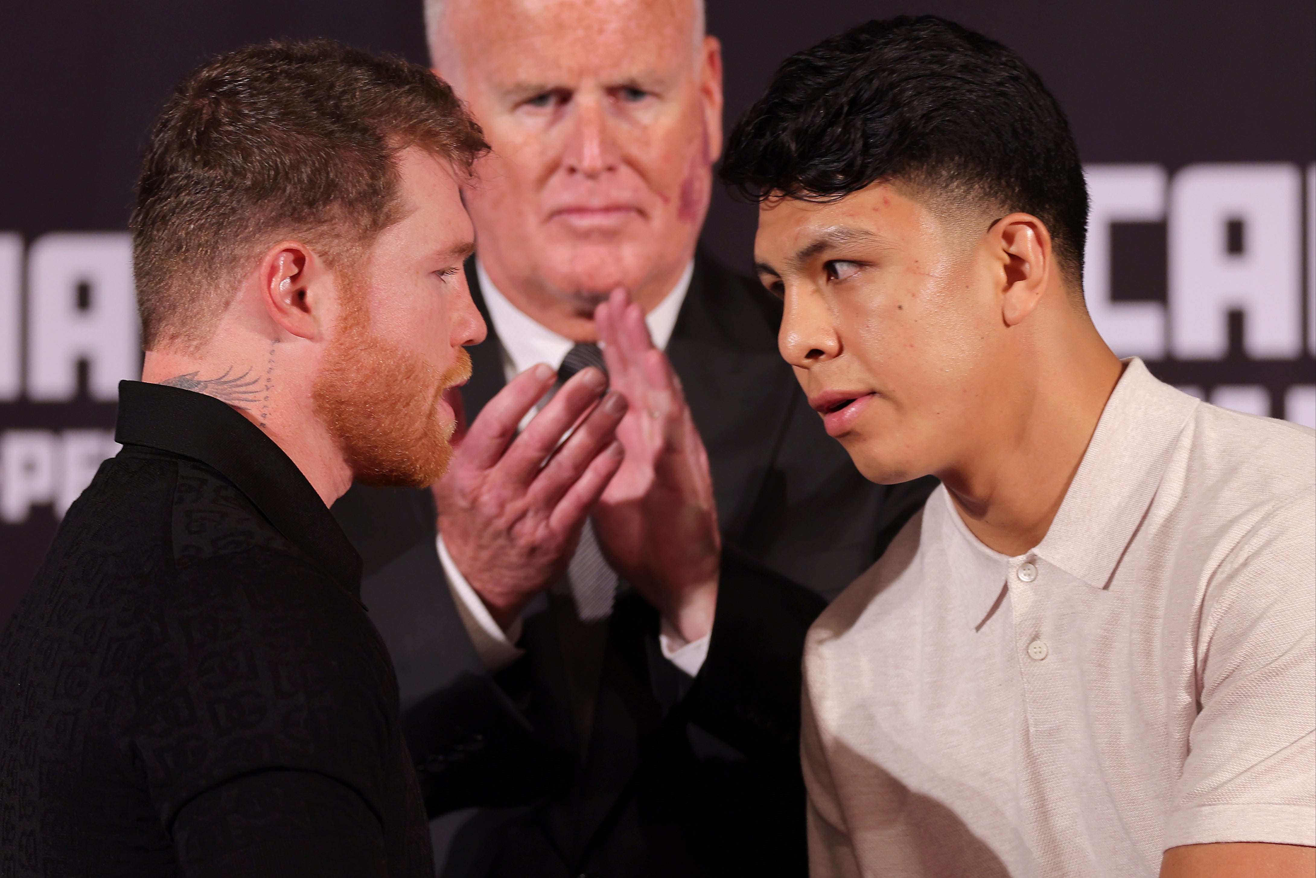 Canelo Alvarez and Jaime Munguia shake hands at a press conference at the Beverly Hills Hotel in March