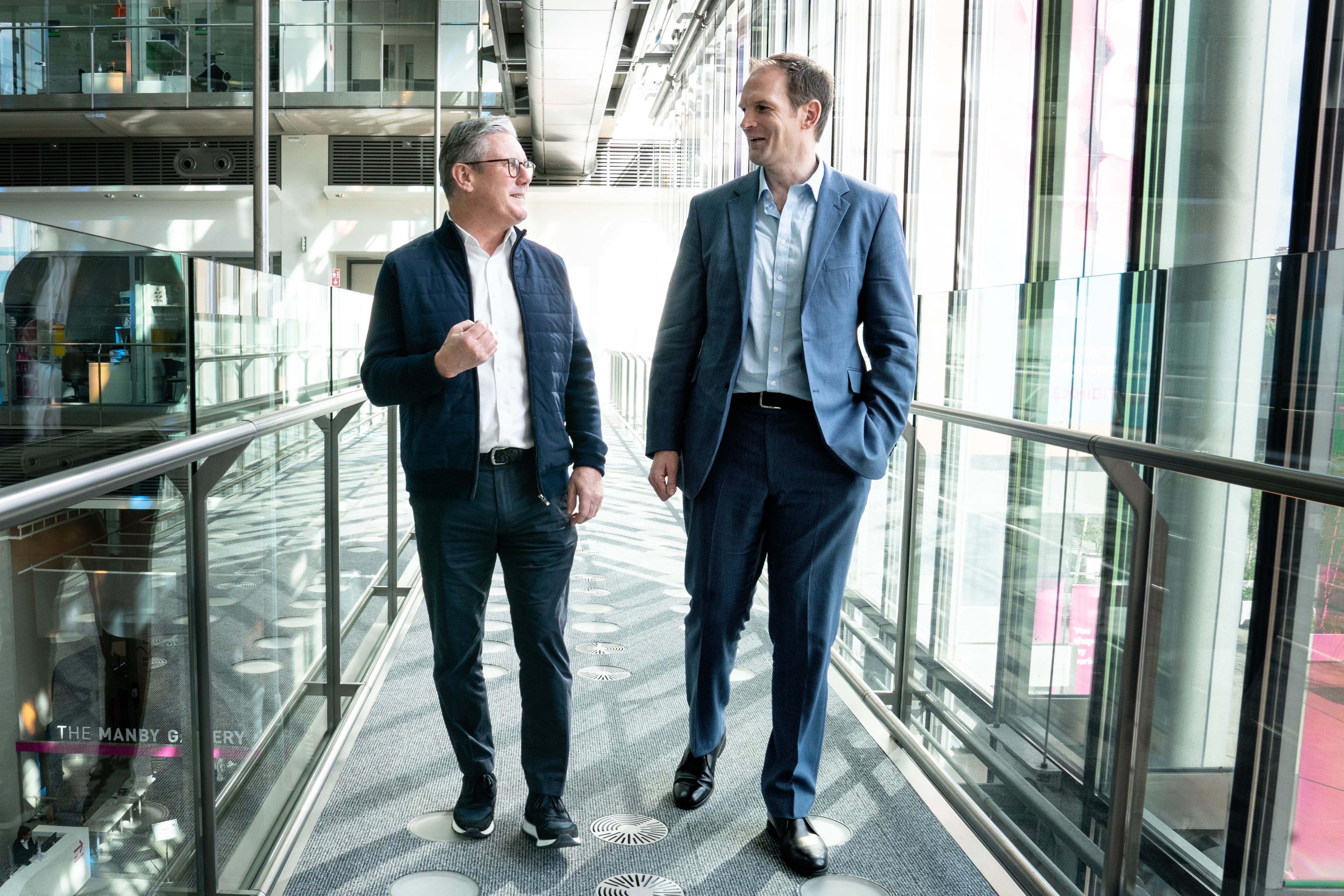 Labour Party leader Sir Keir Starmer welcomes MP and psychiatrist Dr Dan Poulter to the Labour Party at the Francis Crick Institute in London (Stefan Rousseau/PA)