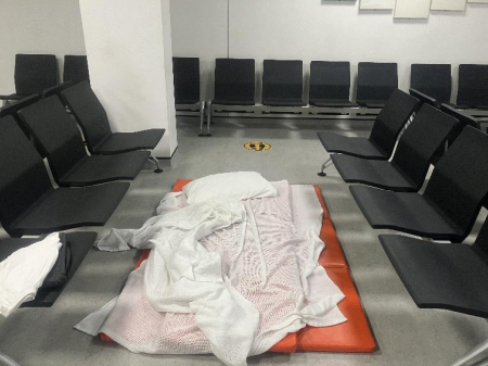 Mattress and bedding between chairs at Heathrow Terminal 3