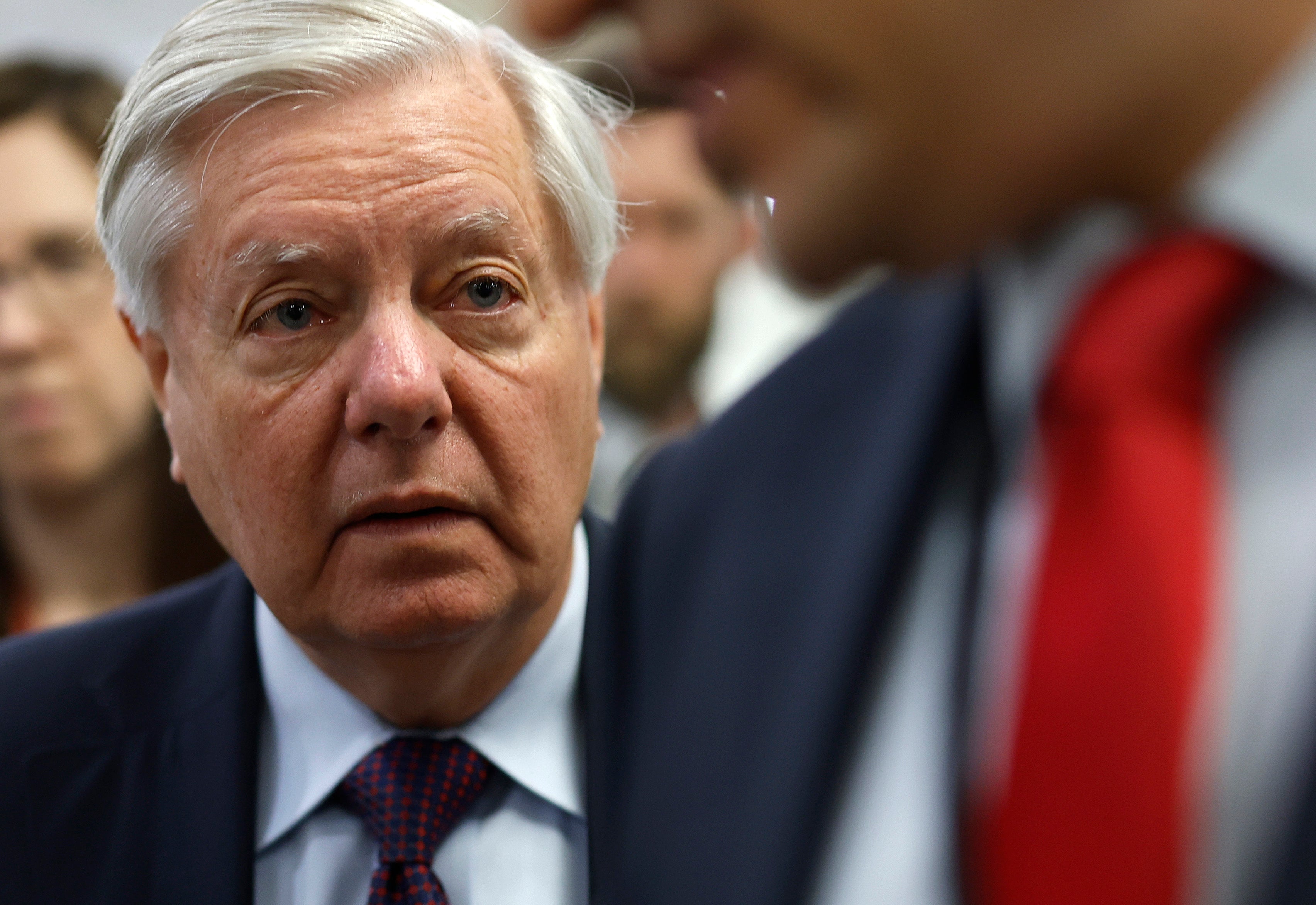 South Carolina Senator Lindsey Graham talks to members of the media as he makes his way to the Senate chamber at the US Capitol on 23 April 2024 in Washington DC