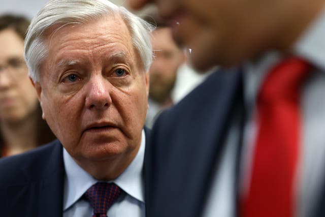 <p>South Carolina Senator Lindsey Graham talks to members of the media as he makes his way to the Senate chamber at the US Capitol on 23 April 2024 in Washington DC</p>