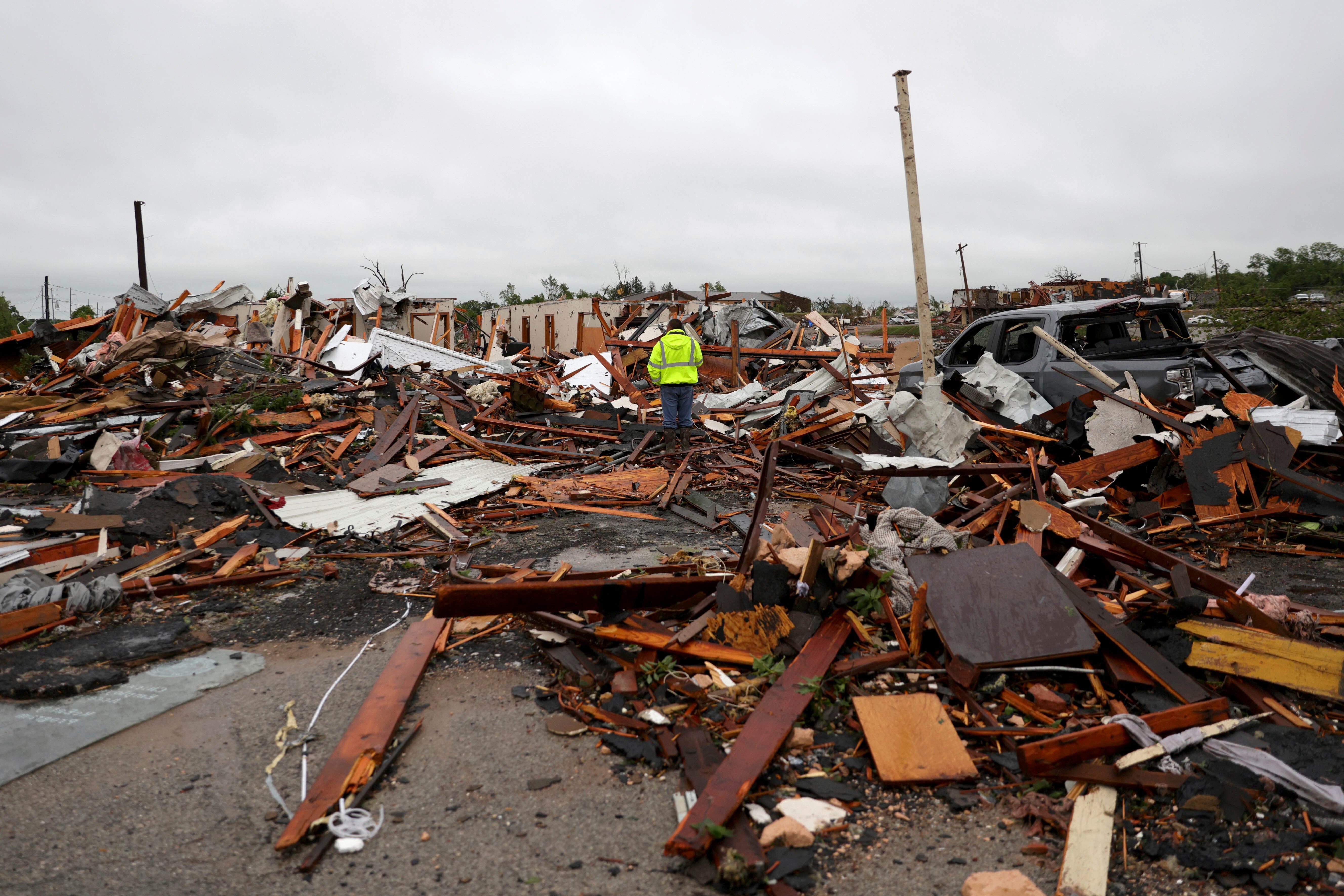 A man surveys storm damage in Sulphur, Oklahoma on Sunday. Governor Kevin Stitt said the town sustained the worst damage he has seen in his career
