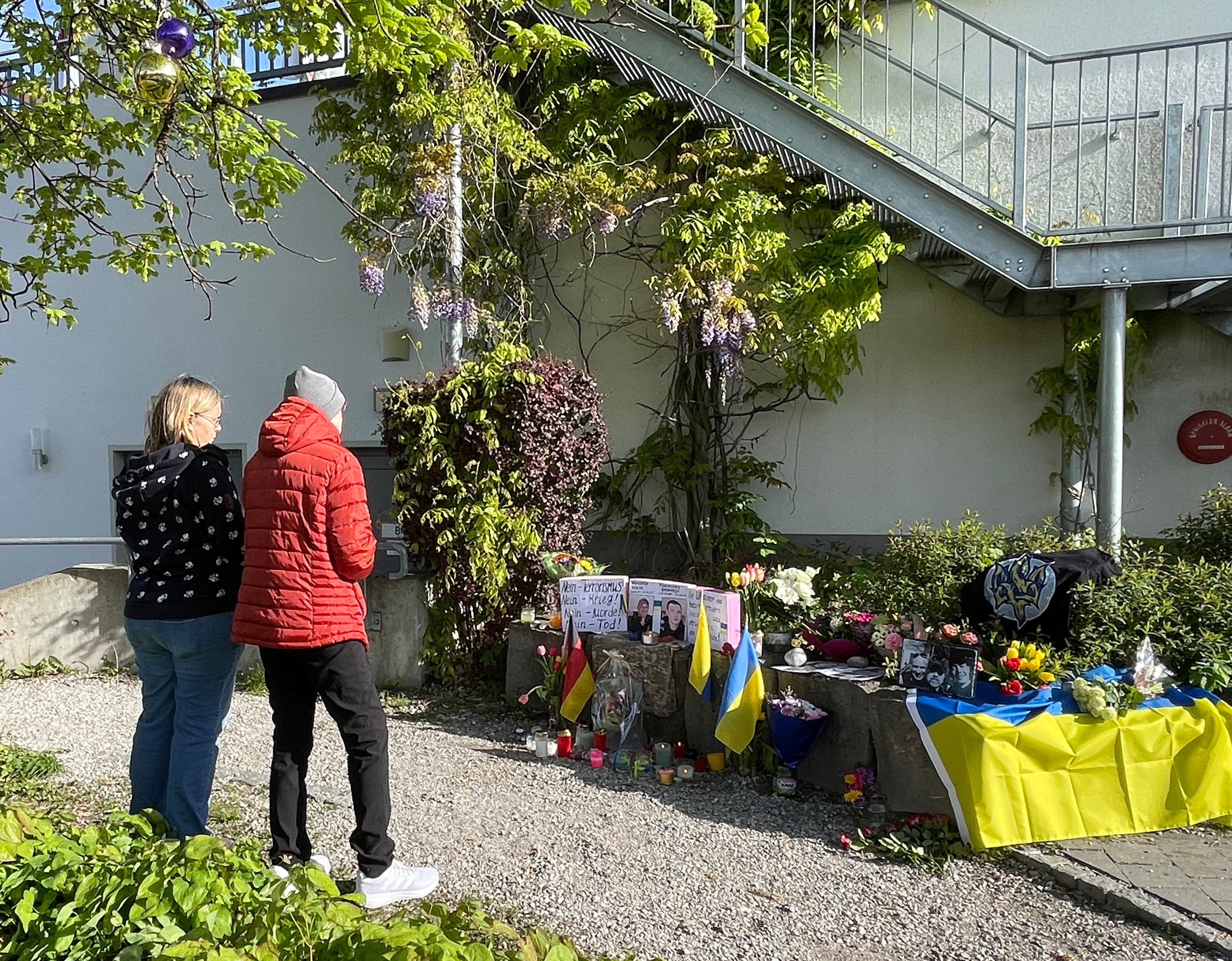 Residents mourn the death of two Ukrainian soldiers in the small southern town of Murnau, Germany