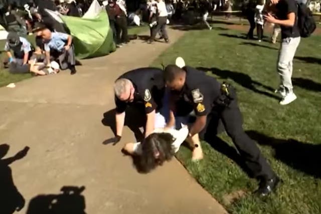 <p>A woman who shouted she was a professor was restrained by police at the pro-Palestine protest at Emory University in Atlanta, Georgia last Thursday </p>