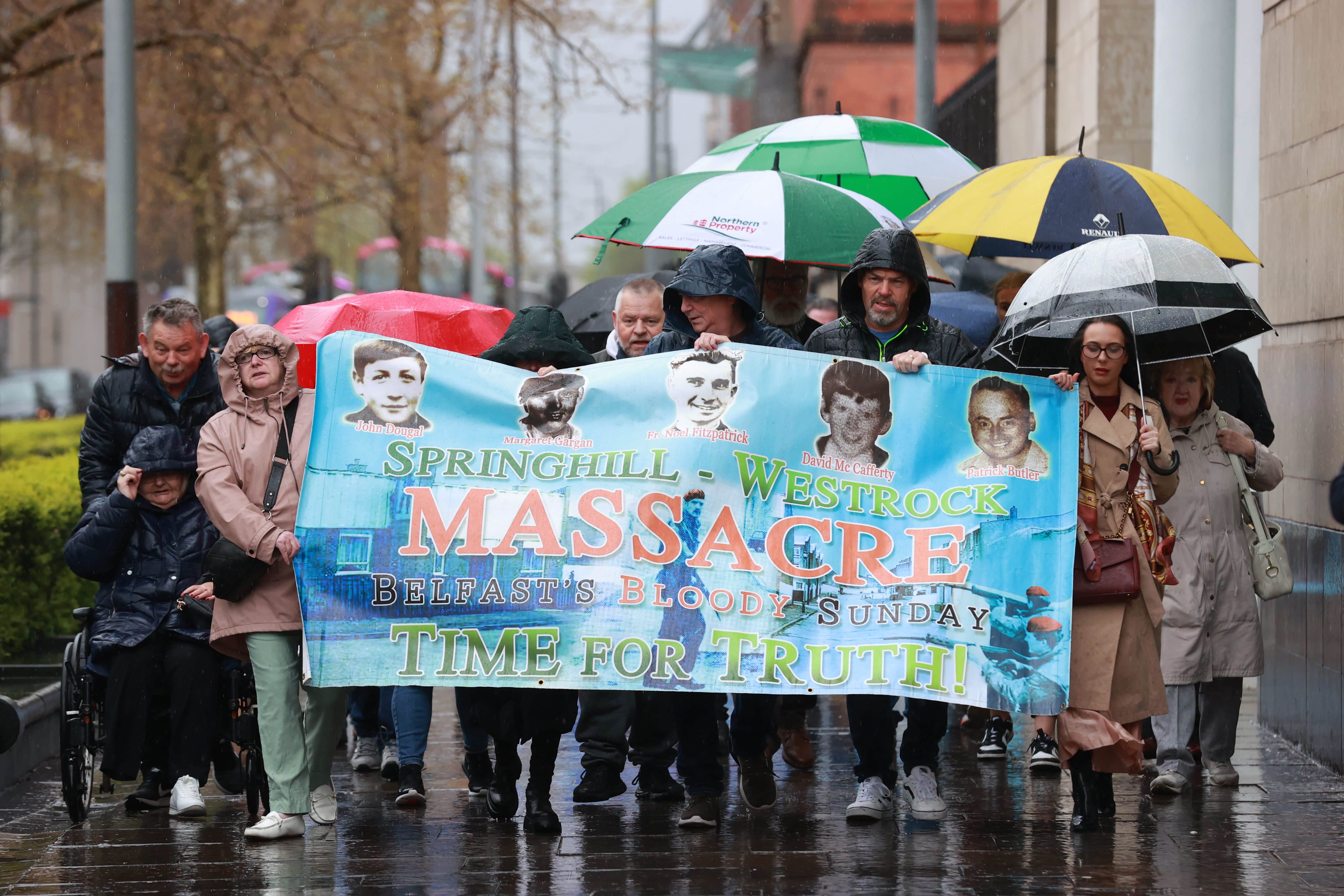 Relatives of those killed during the Springhill Westrock shootings gather outside the coroner’s court at Laganside in Belfast (Liam McBurney/PA)