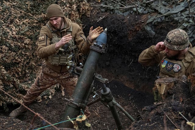 <p>Ukrainian servicemen of the 28th Separate Mechanized Brigade fire a 120-mm mortar towards Russian troops at a frontline in Donetsk</p>