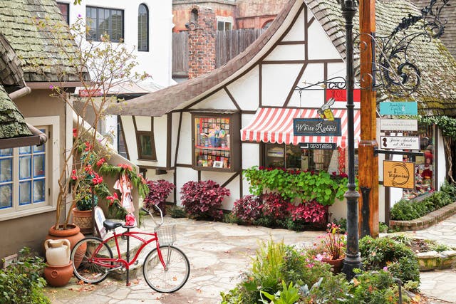 <p> A streetscape in Carmel-by-the-Sea featuring a retail shop housed in a typical  fairytale cottage - style architecture. Carmel located on the Monterey Peninsula was founded in 1902 and is known for its natural scenery and artistic history</p>