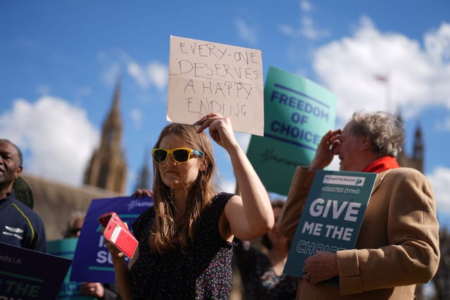 Campaigners in support of voluntary euthanasia protest outside Parliament (Jordan Pettitt/PA)