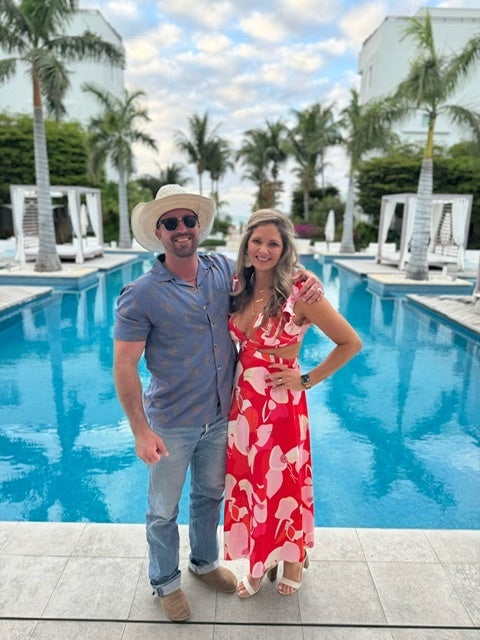 Ryan and Valerie Watson, pictured in Turks and Caicos, were returning home from vacation in April when they were arrested after airport security found four rounds of hunting ammunition in Mr Watson’s carry-on luggage