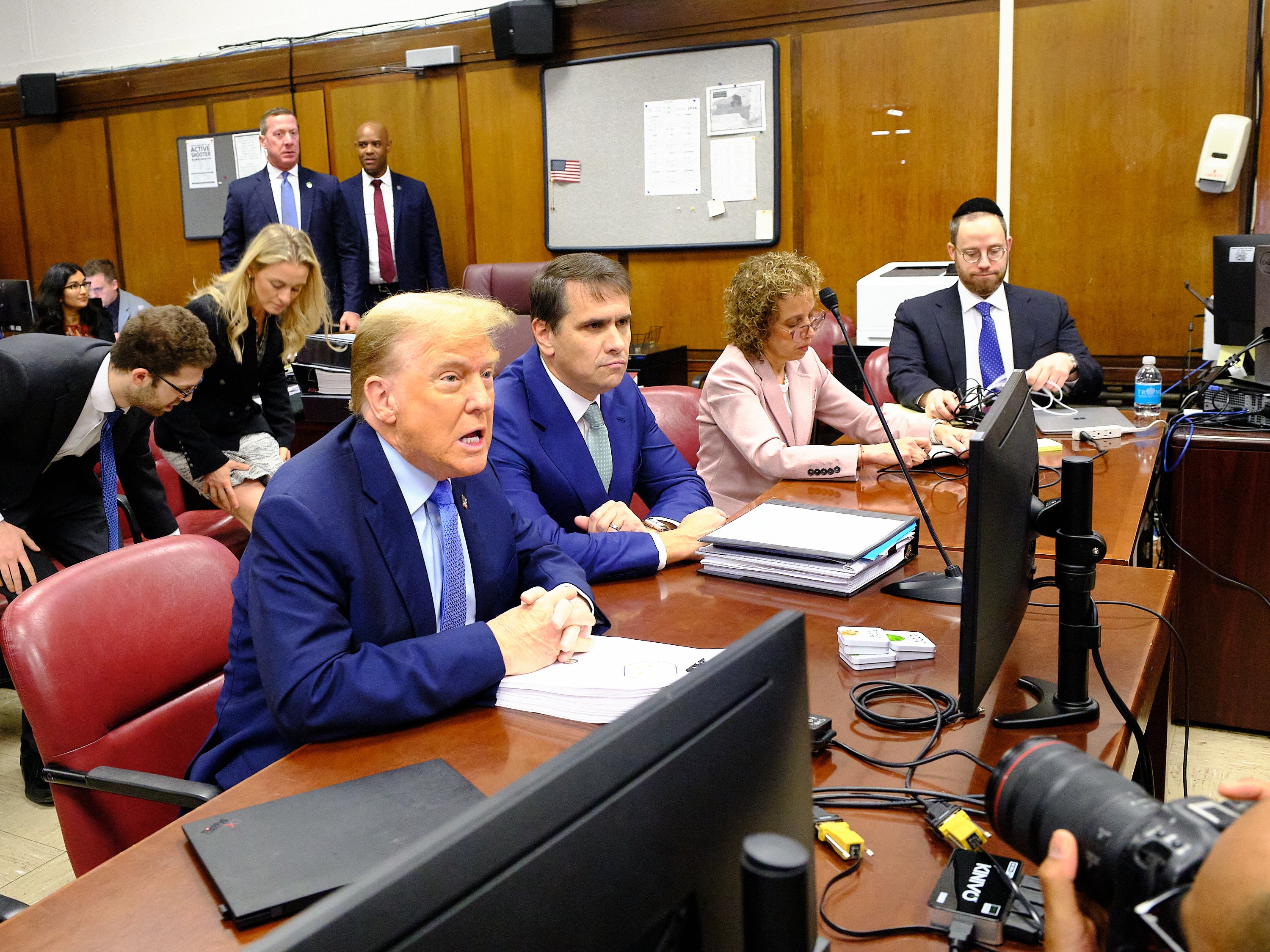 The former president sits with his attorneys in court in Manhattan